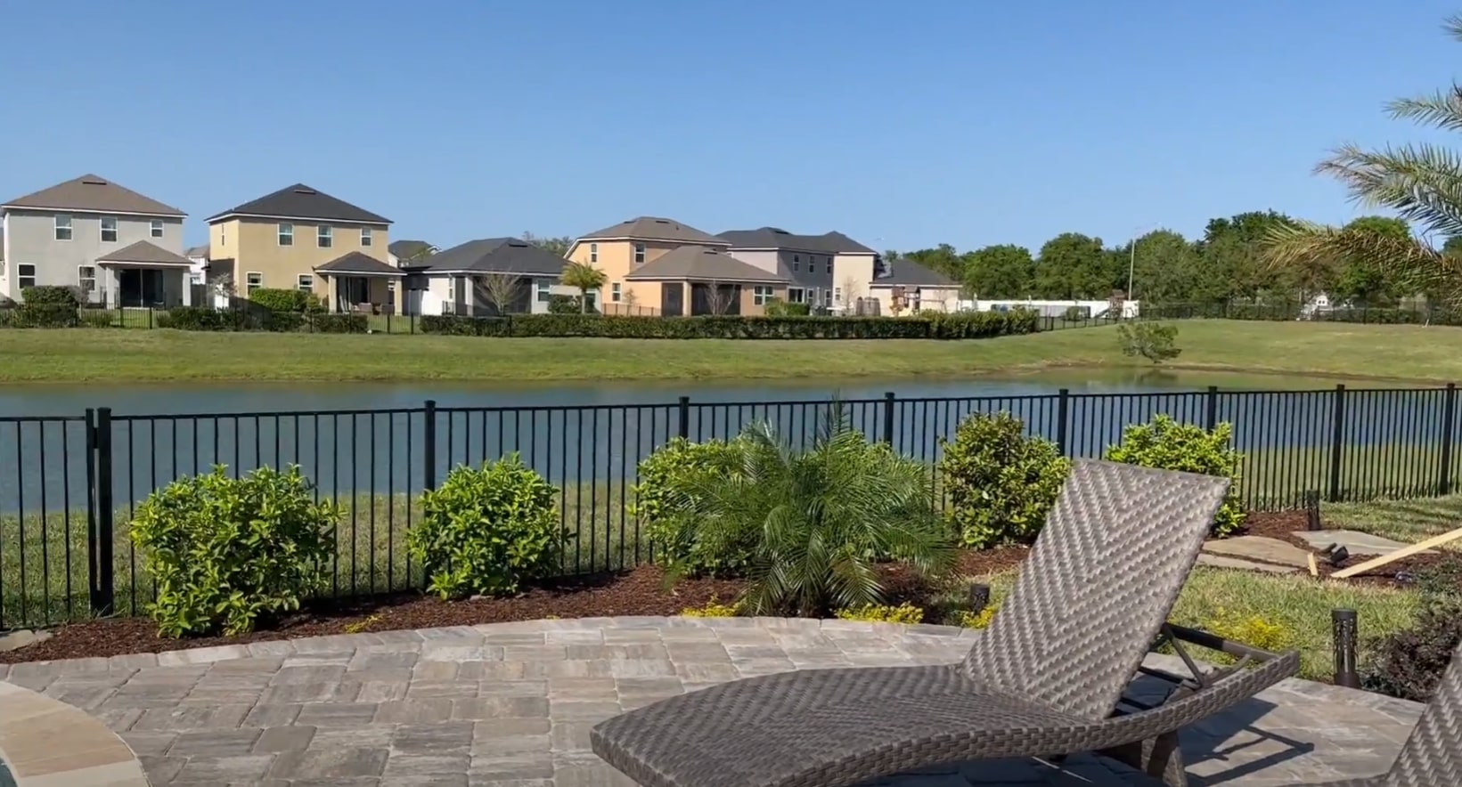 Comprehensive Landscaping Services - Pool Area Design Beautiful residential landscaping with water features and professional lawn care in Greenacres
